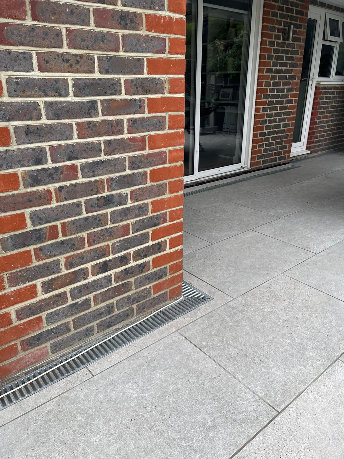 ACOs for surface water drainage from the porcelain patio